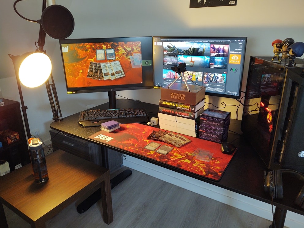 My finished set-up for the Flesh and Blood Monarch pre-release. Camera on top of a stack of books and my oversized mousemat is now a TCG gaming mat.