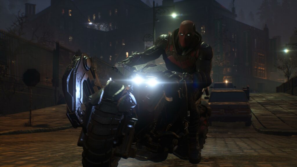 Red Hood using the Batcycle