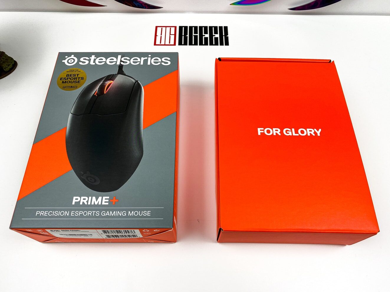 Feature image for Steelseries Prime+ review. The box of the Prime+ and inner box with for glory on it.