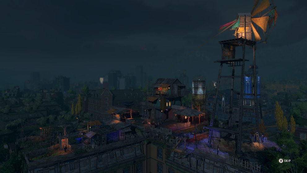 A settlement of the survivors lit up at night.