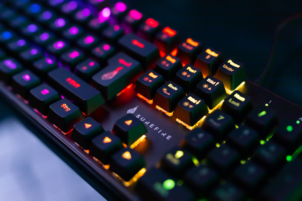 SureFire Kingpin M2 RGB lights lit up under the keyboard keys.