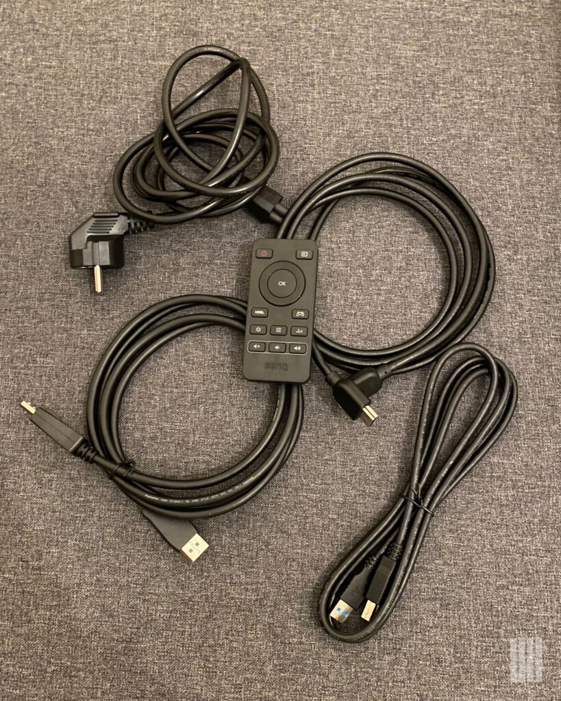 Cables included in the box of the BenQ MOBIUZ EX270QM along with the remote