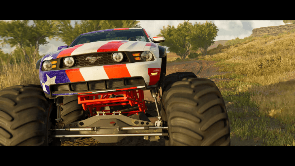 Racing doesn't end with cars, there are monster trucks as seen in this image. American flag style mustang monster truck ready for you to tame.