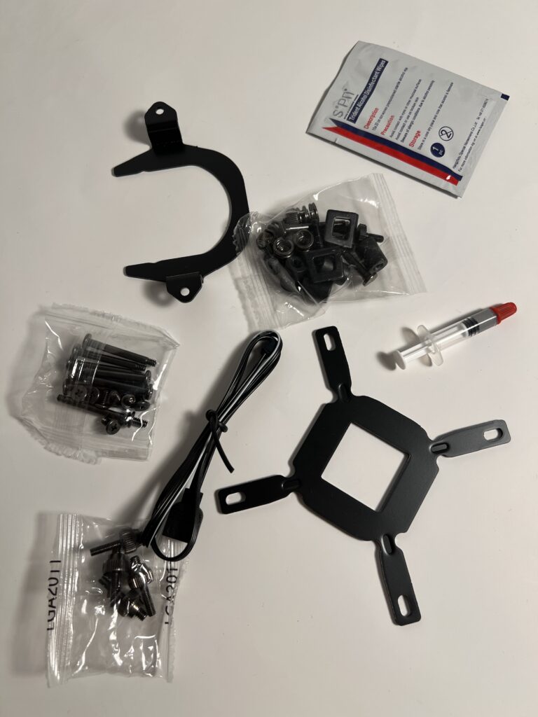 Various parts and mounting screws, extra cooling paste, wipe for your cpu and cables.