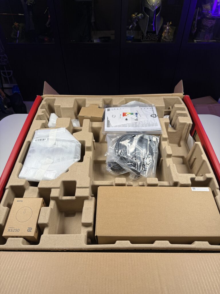 lower side of the inside of the box with two more boxes for the BenQ Zowie XL2566X+, remote and side flaps